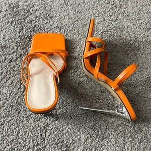 Orange stiletto heels